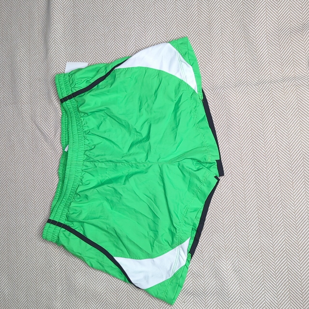 Nike green, black and white shorts size medium